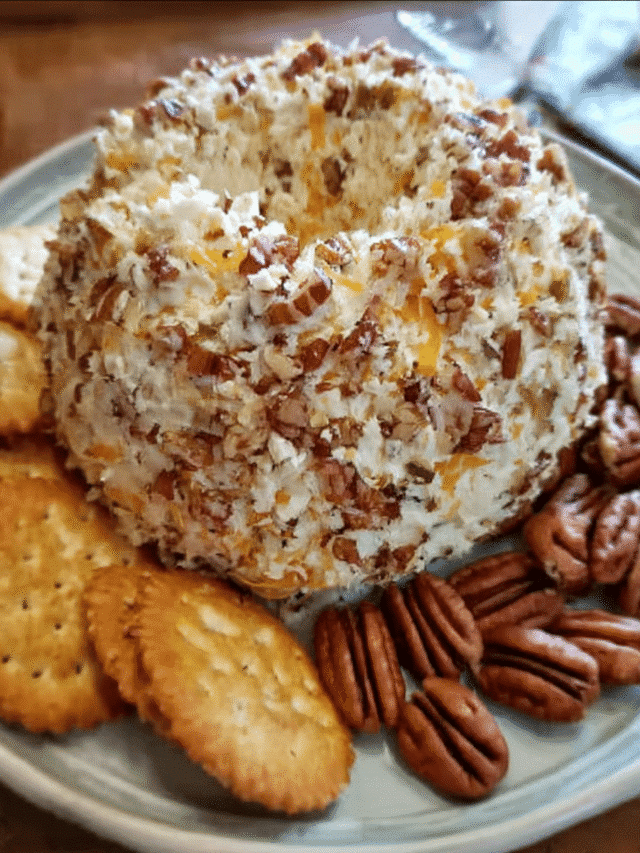 Chicken ranch cheese ball coated in pecans served with crackers