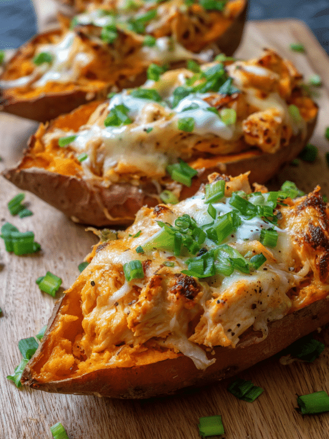 Baked chicken-stuffed sweet potatoes topped with melted mozzarella and spring onions
