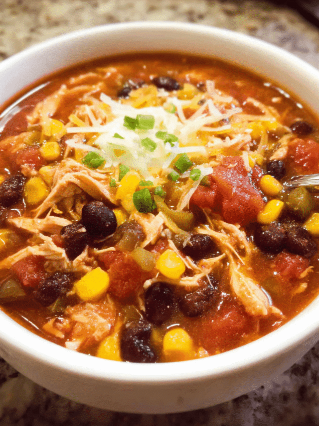 Slow cooker chicken taco chowder in a bowl with toppings