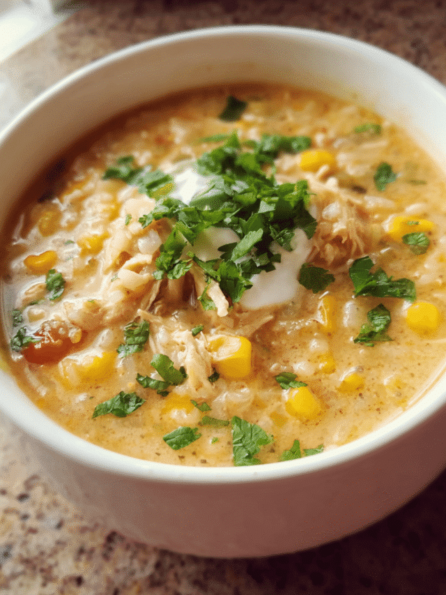 Bowl of creamy Chicken Taco Rice Soup with cilantro garnish