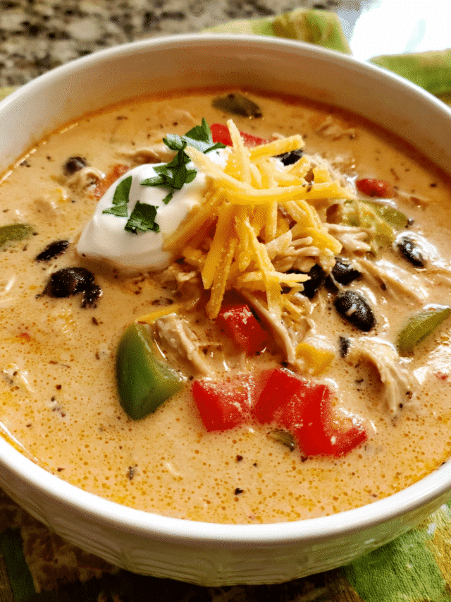 Creamy Chicken Fajita Soup in a bowl with peppers and cheese