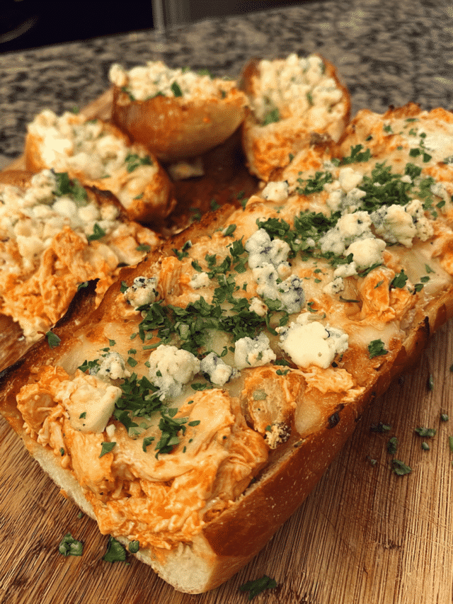 Spicy Chicken Cheese Bread sliced with melted mozzarella and buffalo chicken