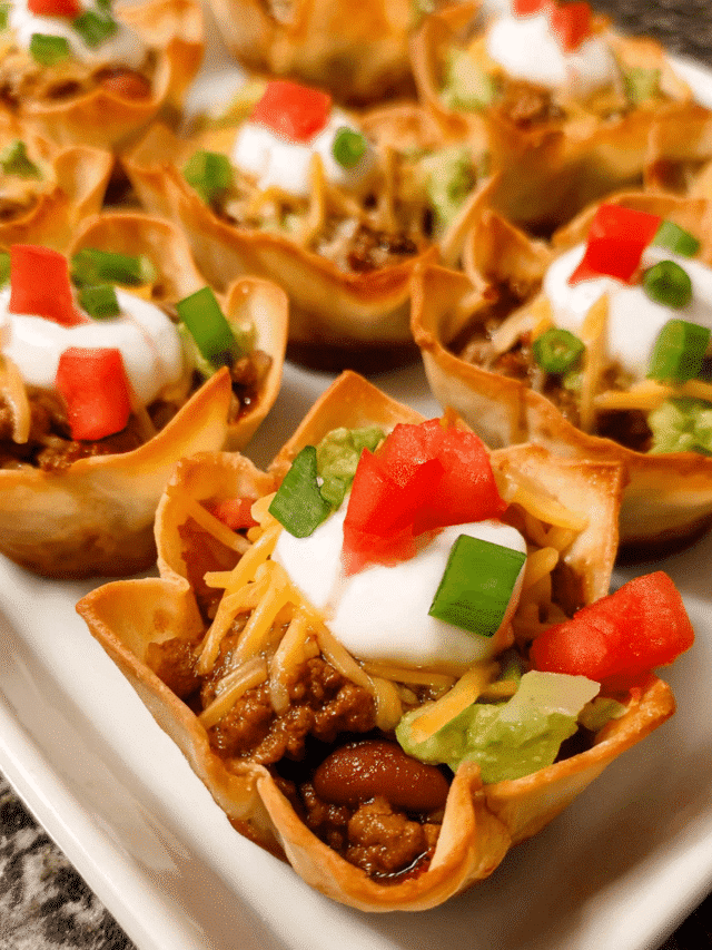 Golden baked taco cups with melted cheese and fresh toppings