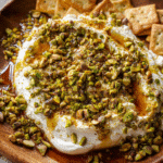 Creamy Boursin appetizer topped with pistachios and honey