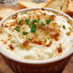 Creamy caramelized onion dip served with chips
