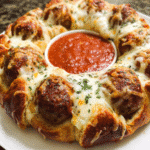 Cheesy meatball pull-apart pizza ring baked with mozzarella and marinara dip