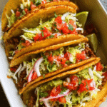 Easy baked tacos with melted cheese and fresh toppings