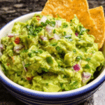How to Make the Best Guacamole in a bowl with tortilla chips