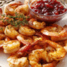 Roasted shrimp served with cranberry cocktail dipping sauce