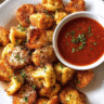 Crispy fried prosciutto tortellini served with tomato sauce