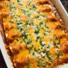 Cheesy chicken enchiladas baked with melted cheese