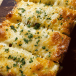 cheesy garlic bread fresh from oven with melted cheese
