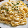 creamy alfredo pasta homemade served with parmesan