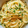 Creamy garlic butter noodles in a bowl with parsley