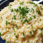 Creamy parmesan risotto served in a bowl with parsley