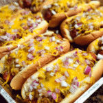 Baked chili cheese dogs casserole fresh from the oven with melted cheddar cheese