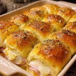 Freshly baked turkey and Swiss cheese sliders with buttery poppy seed topping