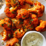 Crispy buffalo cauliflower wings served with ranch dipping sauce