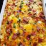 Cheesy bacon breakfast casserole baked with eggs, potatoes, cheddar cheese, and turkey bacon