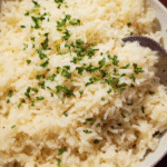 Creamy garlic butter rice bowl served warm with parsley