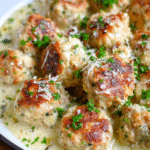 Creamy garlic turkey meatballs in Parmesan sauce served in a skillet