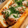 Garlic butter meatball subs with marinara and melted mozzarella