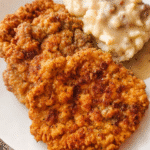 Crispy southern chicken fried steak topped with creamy country gravy