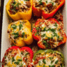Baked stuffed bell peppers filled with beef rice marinara and melted cheese